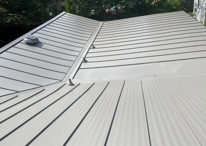 Solar attic fan installed on a metal roof for Roof Ventilation in La Vergne